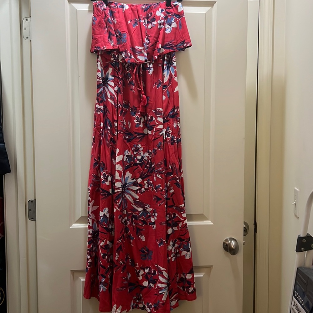 This is a Japna maxi dress with a slit on one side. Floral design.